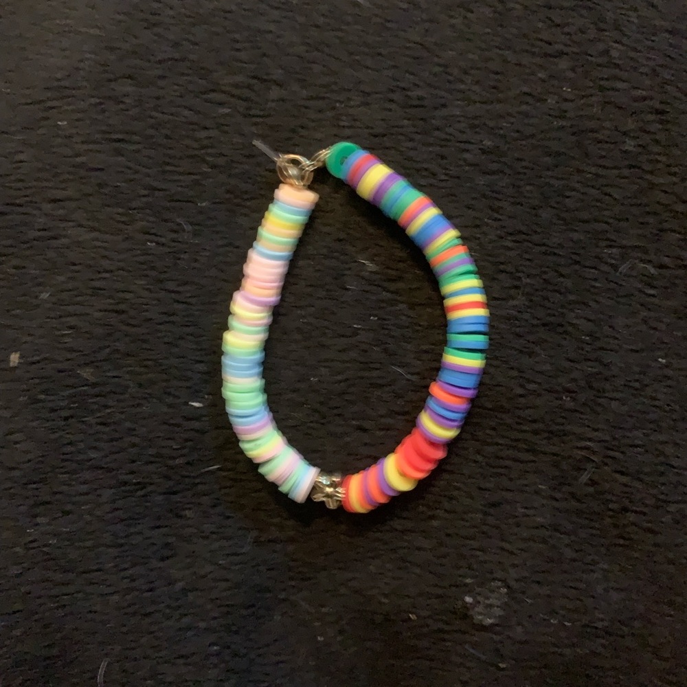 Pastel rainbow and bright rainbow with flower charm in middle clay bead